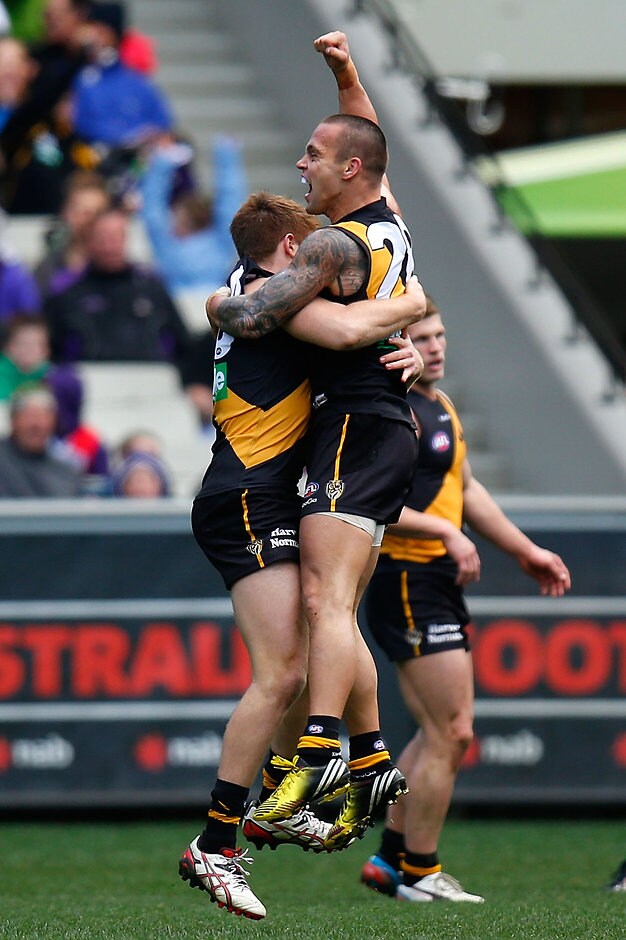 AFL 2013 Rd 17 - Richmond v Fremantle Jake King of the Tigers and Reece Conca of the Tigers celebrate during the 2013 AFL Round 17 match between the Richmond Tigers and the Fremantle Dockers at the MCG, Melbourne on July 21, 2013. (Photo: Michael Willson/AFL Media)